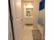 Well-lit bathroom with tiled floors, a modern vanity and matching framed mirror at 244 White Apple Way, Statesville, NC 28625