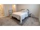 Comfortable bedroom featuring carpet, bed with linens and closet at 244 White Apple Way, Statesville, NC 28625