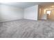 Spacious carpeted bonus room with view of hallway and neutral wall color at 244 White Apple Way, Statesville, NC 28625