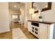 Bright entryway with wood floors, white trim, a decorative table and mirror at 244 White Apple Way, Statesville, NC 28625