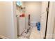 Functional laundry room with a washing machine, dryer, and shelving for storage at 244 White Apple Way, Statesville, NC 28625