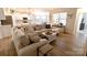 Spacious living room featuring light-colored furnishings, hard wood floors, and lots of natural light at 244 White Apple Way, Statesville, NC 28625