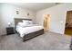 Main bedroom features bed, a nightstand, and an ensuite bathroom with a glass shower at 244 White Apple Way, Statesville, NC 28625