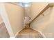 View of the staircase with wood and carpet, leading to the lower level of the home at 244 White Apple Way, Statesville, NC 28625