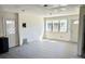 Spacious living room with light-colored wood flooring, new windows offering abundant natural light, and white trim at 2546 Amber Crest Dr, Gastonia, NC 28052