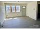 Inviting living room with new flooring, a freshly painted interior, and updated windows providing ample sunlight at 2546 Amber Crest Dr, Gastonia, NC 28052