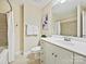 Clean bathroom with white vanity, shower, and neutral tile at 300 W 5Th St # 402, Charlotte, NC 28202