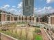 Beautiful courtyard with a central fountain, pool, gazebo, and well-manicured landscaping at 300 W 5Th St # 402, Charlotte, NC 28202