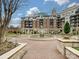 Picturesque courtyard with a decorative fountain, lush greenery, and elegant landscaping at 300 W 5Th St # 402, Charlotte, NC 28202