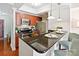 Modern kitchen features stainless steel appliances, dark countertops, and warm wood cabinetry at 300 W 5Th St # 402, Charlotte, NC 28202