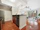 Open concept kitchen featuring stainless steel appliances and a breakfast bar that leads to the living room at 300 W 5Th St # 402, Charlotte, NC 28202