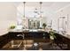 Open kitchen with granite countertops overlooking the living area and outdoor balcony at 300 W 5Th St # 402, Charlotte, NC 28202