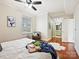Relaxing primary bedroom with ample natural light, wood floors, and ensuite bathroom access at 300 W 5Th St # 402, Charlotte, NC 28202
