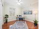 Home office with natural light, wood floors, and decorative rug at 300 W 5Th St # 402, Charlotte, NC 28202