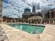 Stunning outdoor pool with lounge chairs and views of the surrounding buildings and cityscape at 300 W 5Th St # 402, Charlotte, NC 28202