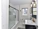 Modern bathroom featuring a glass-enclosed shower and stylish vanity at 3016 Hanson Dr, Charlotte, NC 28207