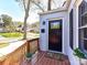 Close-up of the front door and porch with a welcoming doormat and a potted plant at 3016 Hanson Dr, Charlotte, NC 28207