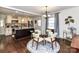 Open kitchen with updated appliances and a dark kitchen island at 3016 Hanson Dr, Charlotte, NC 28207