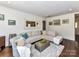 Spacious living room featuring a large sectional sofa and a decorative mirror at 3016 Hanson Dr, Charlotte, NC 28207