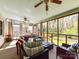 Well-lit screened porch offering cozy seating and scenic outdoor views at 3016 Hanson Dr, Charlotte, NC 28207