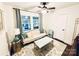 Cozy sitting room with a comfortable sofa, hardwood floors, and natural light at 3016 Hanson Dr, Charlotte, NC 28207