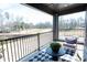 Covered balcony features seating with views of the green space at 317 Old Town Village Rd, Waxhaw, NC 28173