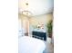 Tastefully decorated bedroom with a bed, black dresser, and a modern light fixture, offering a serene atmosphere at 317 Old Town Village Rd, Waxhaw, NC 28173