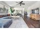Open-concept living room featuring a comfortable sectional sofa and great flow to the dining area at 317 Old Town Village Rd, Waxhaw, NC 28173