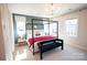 Bright main bedroom with a canopy bed, neutral carpet, and dual windows at 317 Old Town Village Rd, Waxhaw, NC 28173