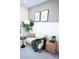 Cozy sitting area with a sofa, accent table, and stylish decor, creating a welcoming and comfortable space at 317 Old Town Village Rd, Waxhaw, NC 28173