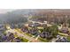 Neighborhood with large homes, manicured lawns, mature trees, and a serene, wooded backdrop at 3907 Voltaire Dr, Monroe, NC 28110