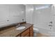 Bathroom featuring vanity with granite countertop, a shower and tub at 3907 Voltaire Dr, Monroe, NC 28110