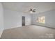 Large bedroom featuring carpet, ceiling fan and large window at 3907 Voltaire Dr, Monroe, NC 28110