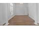 Bedroom featuring hardwood floors, light walls and elegant chandelier at 3907 Voltaire Dr, Monroe, NC 28110