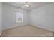 Serene bedroom with carpet floors, a ceiling fan, and a window view at 3907 Voltaire Dr, Monroe, NC 28110
