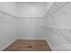 Walk in closet with shelving and wood flooring at 3907 Voltaire Dr, Monroe, NC 28110