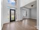 Grand foyer with hardwood floors, high ceilings, and a stylish front door at 3907 Voltaire Dr, Monroe, NC 28110