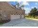 Spacious two-car garage with dormer windows and an extended driveway at 3907 Voltaire Dr, Monroe, NC 28110