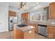 Charming kitchen with granite countertops, stainless appliances, and central island at 3907 Voltaire Dr, Monroe, NC 28110