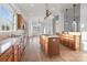 Gourmet kitchen featuring granite countertops, a large island, and stainless appliances at 3907 Voltaire Dr, Monroe, NC 28110