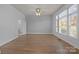 Living room featuring hardwood floors, light walls and lots of natural light at 3907 Voltaire Dr, Monroe, NC 28110