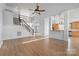 Open-concept living area with hardwood floors and access to the upper level at 3907 Voltaire Dr, Monroe, NC 28110
