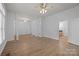 Spacious living room features hardwood floors, modern lighting, and neutral paint at 3907 Voltaire Dr, Monroe, NC 28110