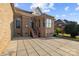 Back exterior features brick, patio, and entrance area at 3907 Voltaire Dr, Monroe, NC 28110