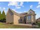 Rear exterior of brick home with patio, grassy yard and blue skies at 3907 Voltaire Dr, Monroe, NC 28110