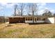 Beautiful backyard with a fire pit and a screened in back porch at 401 Dakota St, Kannapolis, NC 28083