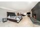 Spacious basement bedroom with brick fireplace, painted concrete floors, and neutral walls at 401 Dakota St, Kannapolis, NC 28083