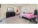 Cozy bedroom with carpet flooring, natural light, and ample closet space at 401 Dakota St, Kannapolis, NC 28083