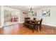 Sunlit dining room with hardwood floors and sliding door access to an outdoor area at 401 Dakota St, Kannapolis, NC 28083