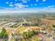 Expansive aerial view showcasing the property with lush surrounding landscape and mountain views at 4055 10Th Avenue Sw Dr, Hickory, NC 28602